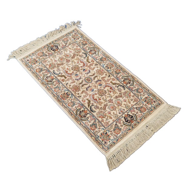 Vintage Karastan 100% wool area rug / mat / carpet featuring a floral motif inspired by palmettes and scrolled vines with...