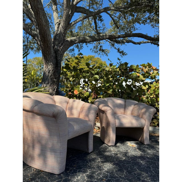 A striking pair of vintage postmodern lounge chairs featuring bold sculptural lines, generous proportions, and exceptional...