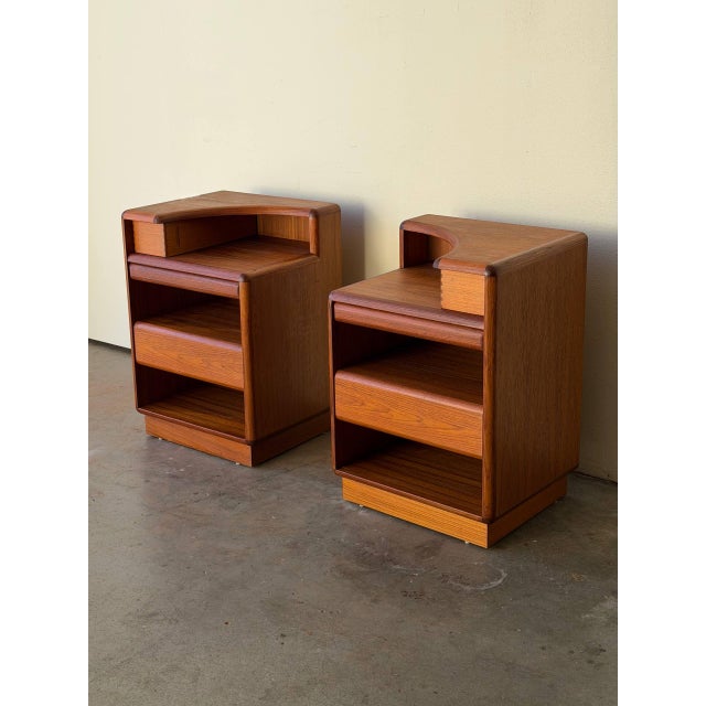 Elegant pair of Danish Mid-Century Modern teak nightstands by Brouer, crafted in Denmark in the 1960s. These sculptural...