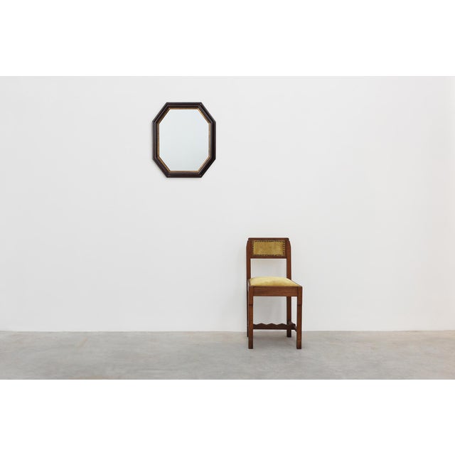 An elegant octagonal wall mirror by the Belgian manufacturer Deknudt, dating to the second half of the 20th century. The...