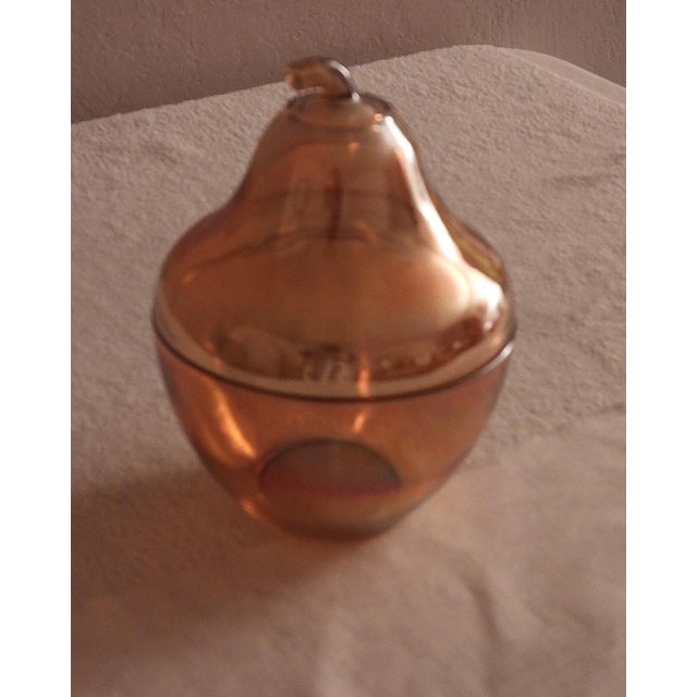 This marvelous vintage 1930s pear shaped box was made by Jeannette, a well-known American glass maker in carnival glass in...