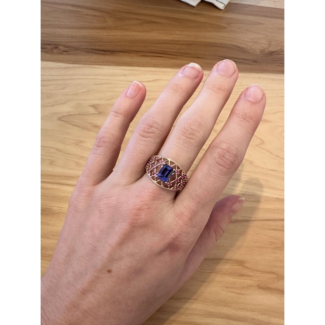 Enhance your look with this gorgeous tanzanite ring featuring a stunning 1.43ct emerald-shaped tanzanite and sparkling...