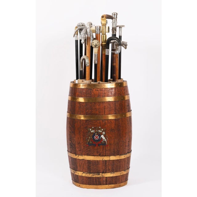 This is an elegant George III antique solid oak brass bound walking stick stand, circa 1810 in date. The oak stand is of...