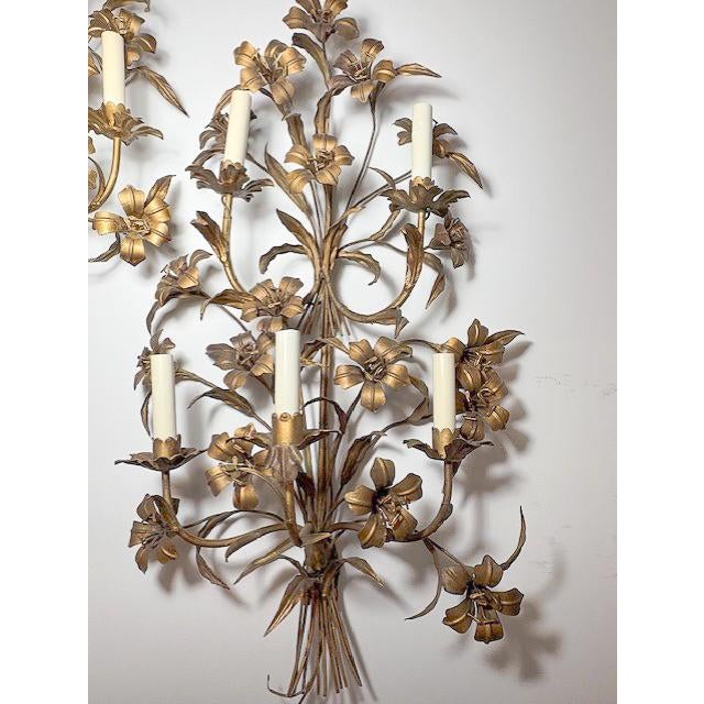 A stunning duo of ornate vintage sconces, each featuring five lights and beautifully crafted in gilt tole. Intricately...