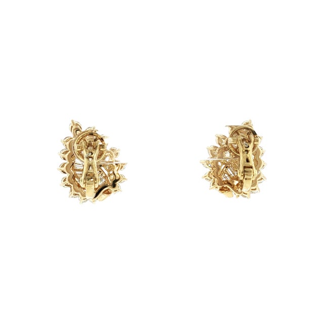A pair of mid-20th-century 18k yellow gold diamond earrings by Kurt Wayne. Features 34 brilliant-cut diamonds totaling 2.5...