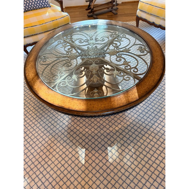 Beautiful solid Mahogany wood, hand carved coffee table. Glass top and metal underlay. Excellent condition. It has been in...