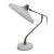 - Mid-Century table lamp - Designed by Oscar Torlasco for Lumi - Features a curved brass structure - White lacquered steel...