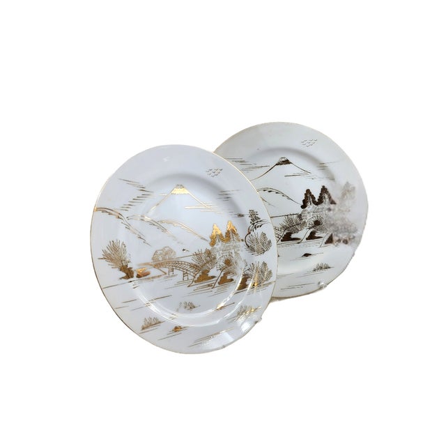 A golden hush settles over Mt. Fuji in this exquisite set of four vintage Kutani porcelain plates. Each piece is...