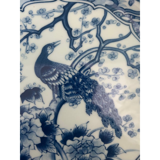 Large vintage TOYO Japan blue and white porcelain decorative charger featuring an intricately rendered peacock surrounded...