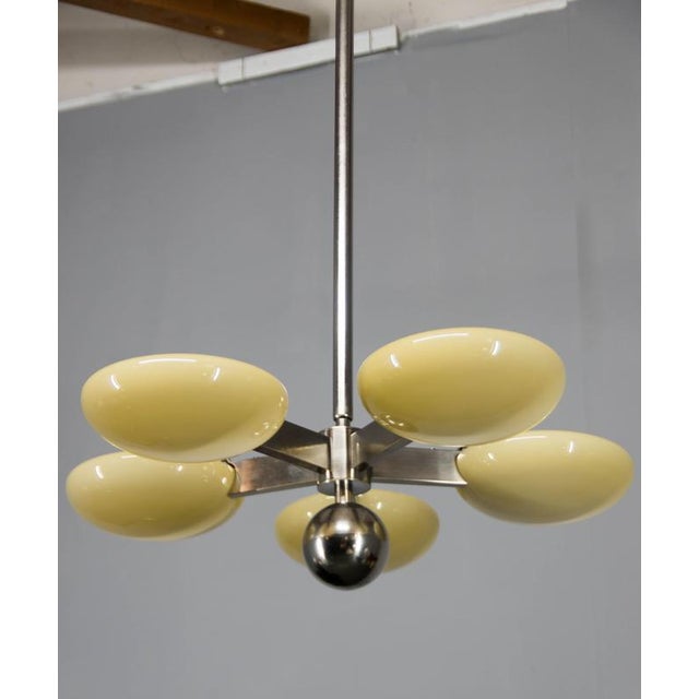 A beautifully proportioned art deco chandelier dating from the 1930s, executed in the spirit of european functionalism....