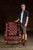 Handsome tufted leather armchair upholstered in deep oxblood leather, with button-tufting across the high back and seat....