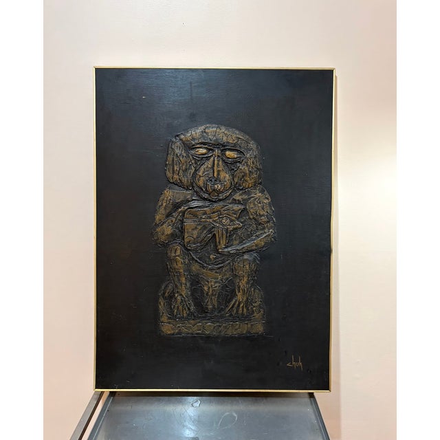 1960s-70s black/gold midcentury carved wood monkey relief/wall sculpture/painting on solid board in gold metal frame....
