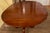 This is a gorgeous fine quality table in good vintage condition made of Wild Black Cherry Wood by Henkel Harris in...