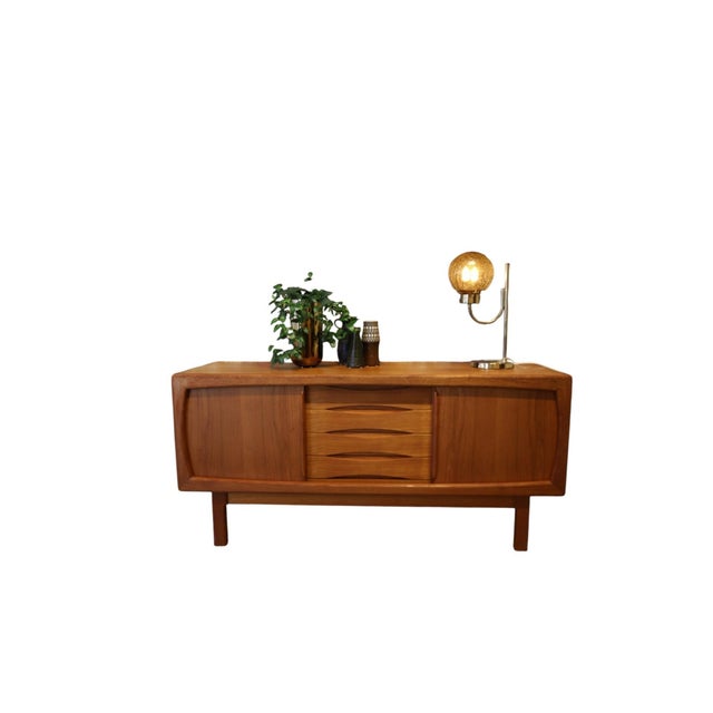 A wonderful and very stylish sideboard in teak, designed by burchardt nielsen and h.p. Hansen for the danish furniture...