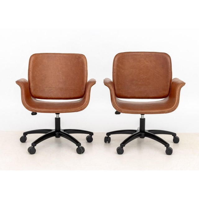 Pair of Modern Tan Leather Adjustable Desk Chairs, on chrome-plated and black five-point star base with casters. Tallest...