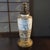 The Antique Nippon Scenic Moriage Hand Painted Table Lamp is a stunning piece originating from Japan in the late 19th...