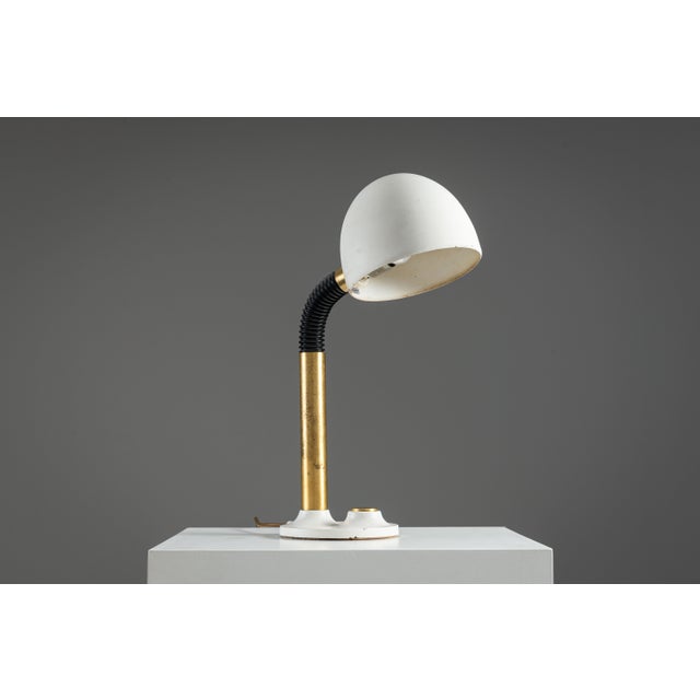 This vintage table lamp by Egon Hillebrand reflects the refined balance of function and elegance that defines mid-20th-...
