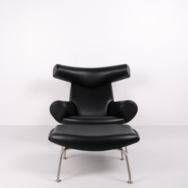 Ox chair model ej100 with matching ottoman designed by hans j. Wegner. The model was designed in 1960 and is produced...