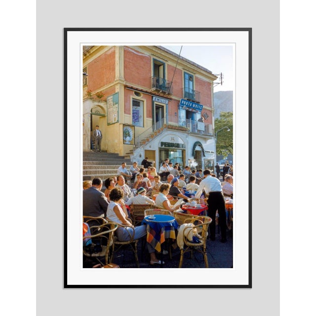 Capri Café by Toni Frissell Diners sit at an alfresco café in Capri, 1959. (Toni Frissell) Archival Pigment Print 40 x 30"...