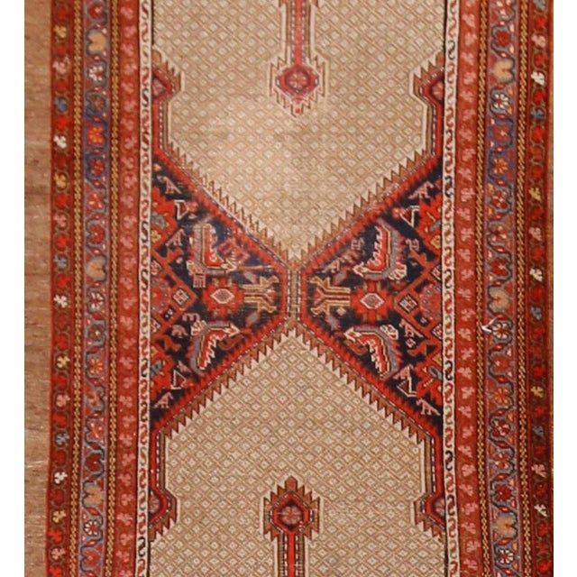 A beautiful hand-knotted rug, traditionally crafted by skilled artisans using fine-quality wool. The hand-knotted...