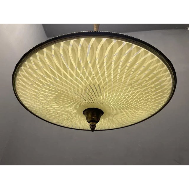 Vintage bronze glass light pendant 1950’s bronze frame with glass shade. height 90 cm width 45 cm depth 45 cm features 2...