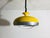 Vintage Space Age Hanging Lamp in Bright Yellow, 1960s, in Very Good conditions. Designed 1970 to 1979 This piece has an...