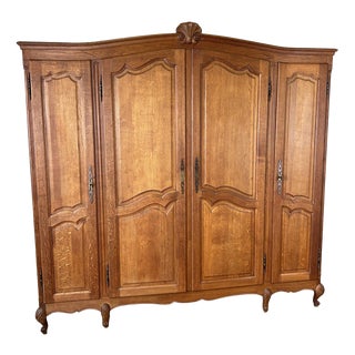Vintage Louis XVI French Four Door Oak Carved Armoire For Sale