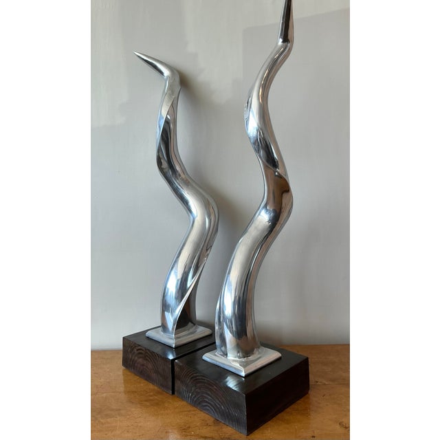 Elevate your interior with the striking sculptural presence of this vintage pair of abstract chrome sculptures. Their...