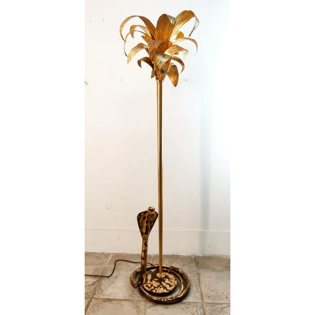 Brass Palm Floor Lamp with Cobra, in Very Good conditions. Designed 1970 to 1979 European Plug (up to 250V).The wiring of...