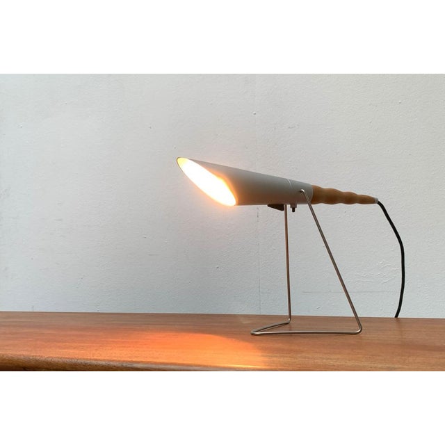 Very rare table or wall lamp from the Swiss manufacturer Belux based on a design by Hannes Wettstein from the early 1990s....