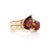 Make an unforgettable statement with the deep crimson intensity of natural red garnet. Arranged in a symbolic two-stone...