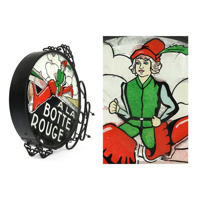 Illuminated sign ''A la botte rouge''. Old sign. Represents the brand logo and an illustration. This piece is designed in...