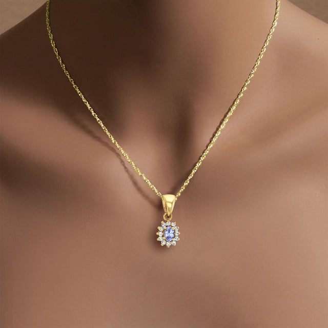 ♥ Pendant Summary ♥ Main Stone: Tanzanite & Diamond Material: 14K Yellow Gold Stone Cut: Oval/Round Dimensions: 16MMX 11MM...