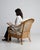 A armchair whose natural rattan frame, cream upholstered cushions gives it real character at first glance. It was made in...