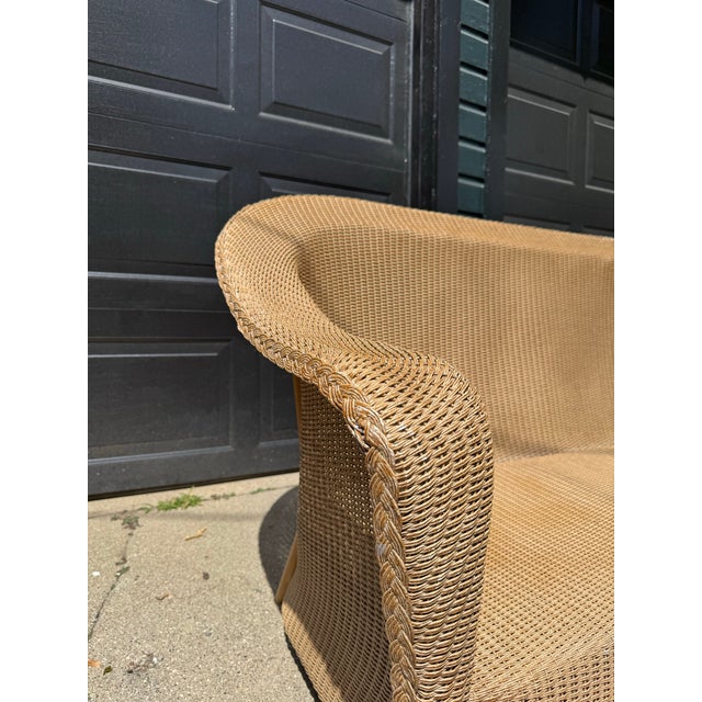 Vintage Lloyd Flanders all weather wicker couch in need of repair. Blue metal tag present on its underside. Please review...
