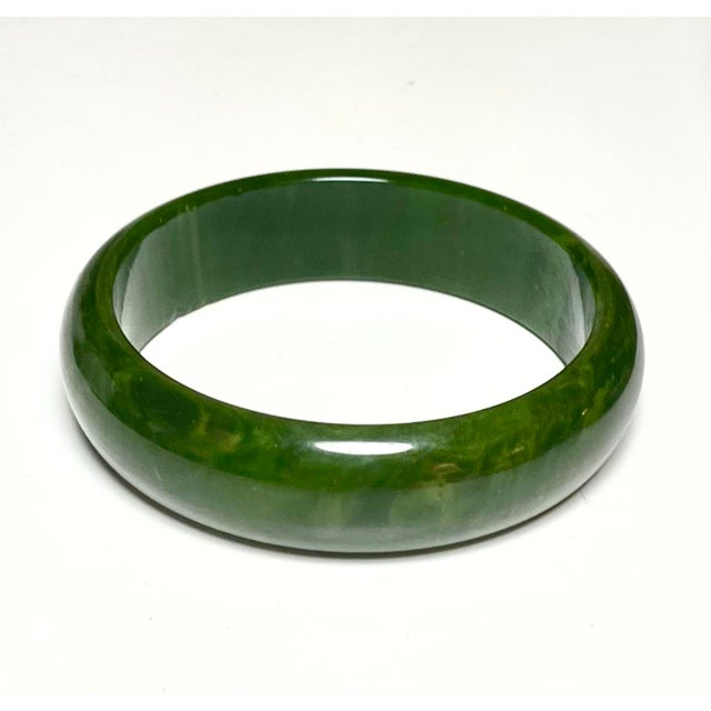 This is part of Chairish’s Costume Jewelry assortment. 3 marbled Bakelite Bangle Bracelets from the 1930s in Green,...