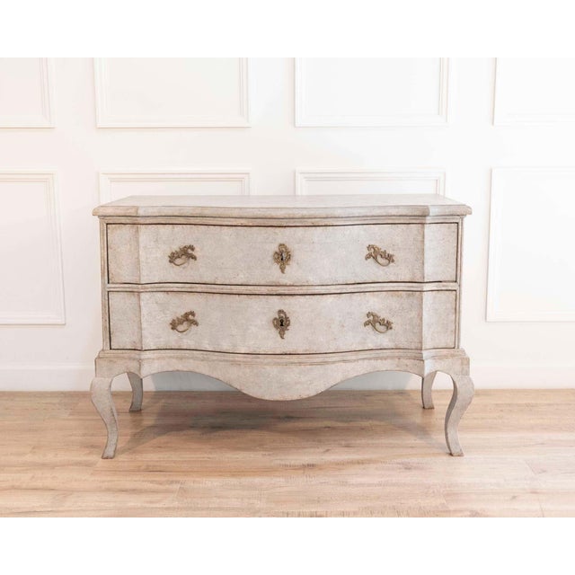 This elegant Swedish Baroque chest of drawers dates to the late 18th century, circa 1790–1810, and exemplifies the...