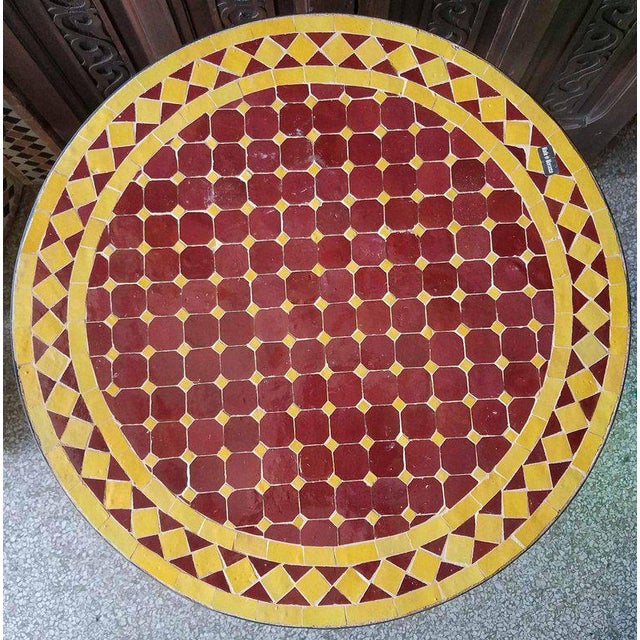 100 % glazed round. Burgundy and yellow Moroccan mosaic table measuring approximately 24″ in diameter. For both indoors...