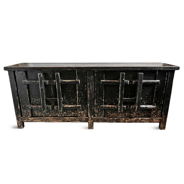 Vintage black worn finish solid elm wood sideboard. Wonderful rustic lodge style. Four doors with sliding locks which open...
