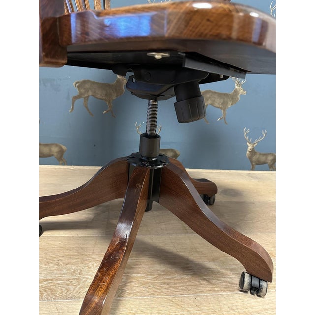 Classic mahogany desk chair with a green leather seat. Beautiful appearance and comfortable chair for daily use. The chair...