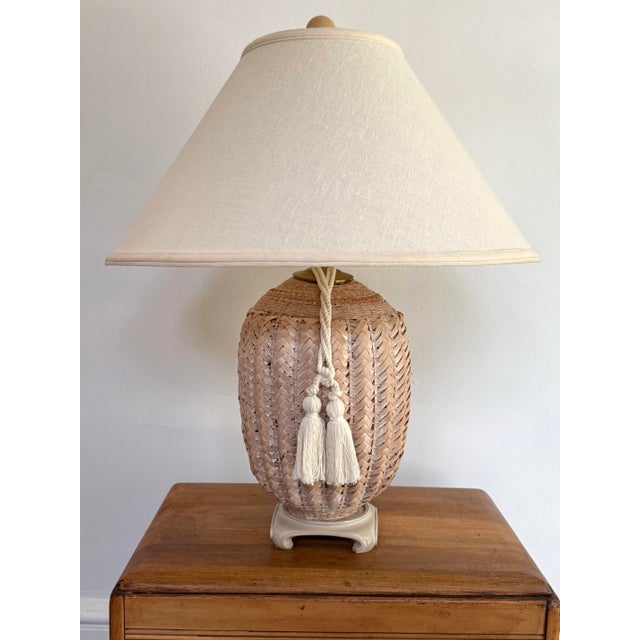 Attractive whitewashed wicker basket lamp with matching cream tassel. Mounted on an Asian base. Please see condition...