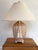 Attractive whitewashed wicker basket lamp with matching cream tassel. Mounted on an Asian base. Please see condition...