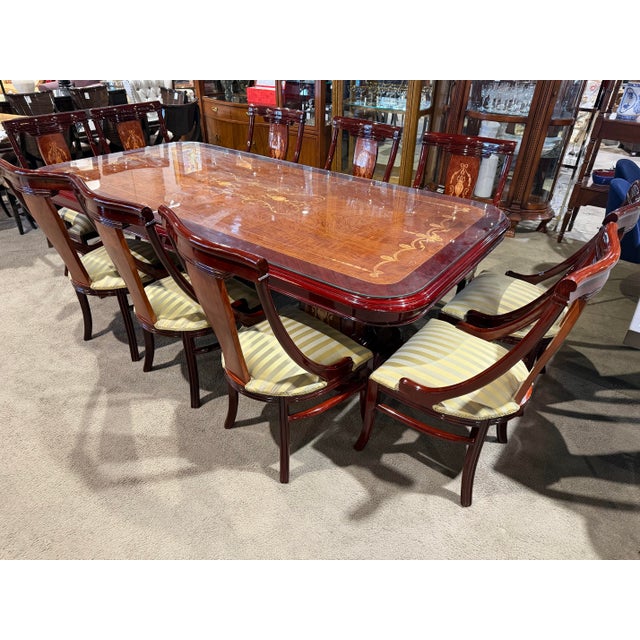 An exquisite showcase of Old World craftsmanship, this Italian double pedestal dining set embodies timeless elegance and...