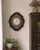 A striking 19th-century French cartel wall clock featuring an elegant shaped ebonized wood case with hand-inlaid mother-...
