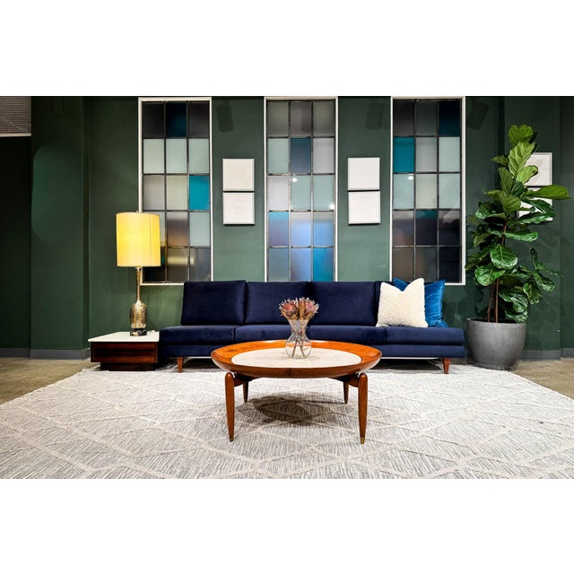This rare four-seat sofa exemplifies Joaquim Tenreiro’s radical redefinition of modern seating in postwar Brazil, where...
