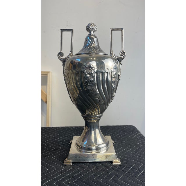 A grand and highly decorative Victorian-era silverplate samovar by the renowned Sheffield silversmiths James Dixon & Son....