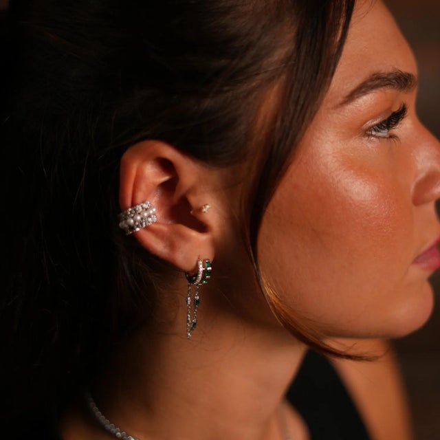 Exude sophistication with the Emerald Stone Design Sterling Silver & Diamond Dangle Earrings. Crafted from high-quality...