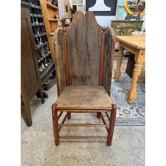 An authentic 19th-century primitive fireside wing chair, handcrafted in the true “make-do” tradition of rural American...