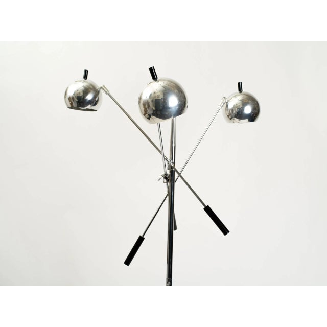 Chrome "orbital" floor lamp with three adjustable arms.