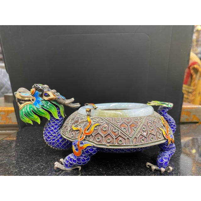 Elevate Your Collection with a Stunning 1920s Sterling Silver Enamel Dragon Cloisonné Ashtray Jade Rim Step into a world...
